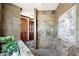 Spacious walk-in shower with multiple shower heads and mosaic tile feature at 8876 S Santa Elizabeth Dr, Goodyear, AZ 85338