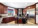 Updated kitchen with stainless steel appliances and granite counters at 8876 S Santa Elizabeth Dr, Goodyear, AZ 85338
