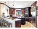 Gourmet kitchen with granite counters, island, and stainless steel appliances at 8876 S Santa Elizabeth Dr, Goodyear, AZ 85338