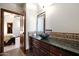 Well-lit bathroom with granite vanity and vessel sink at 8876 S Santa Elizabeth Dr, Goodyear, AZ 85338
