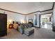 Bright bedroom with sitting area and access to another room at 8876 S Santa Elizabeth Dr, Goodyear, AZ 85338