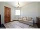 Cozy sitting area featuring a sofa and plenty of natural light at 8876 S Santa Elizabeth Dr, Goodyear, AZ 85338