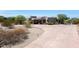Two-story home with desert landscaping and a stamped concrete driveway at 8876 S Santa Elizabeth Dr, Goodyear, AZ 85338