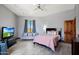 Bedroom featuring a queen bed and ample natural light at 8876 S Santa Elizabeth Dr, Goodyear, AZ 85338