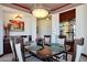 Spacious dining room with built-in bar and large windows at 8876 S Santa Elizabeth Dr, Goodyear, AZ 85338