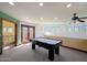 Game room with pool table and access to balcony at 8876 S Santa Elizabeth Dr, Goodyear, AZ 85338