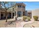 Stone exterior of a house with a courtyard and entrance at 8876 S Santa Elizabeth Dr, Goodyear, AZ 85338