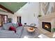 Living area with a fireplace and comfortable seating at 8876 S Santa Elizabeth Dr, Goodyear, AZ 85338