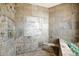 Large walk-in shower with mosaic tile detail and built-in seating at 8876 S Santa Elizabeth Dr, Goodyear, AZ 85338