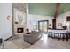 Cozy living room with a fireplace and access to backyard at 8876 S Santa Elizabeth Dr, Goodyear, AZ 85338
