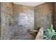 Walk-in shower with mosaic tile and built-in seat at 8876 S Santa Elizabeth Dr, Goodyear, AZ 85338