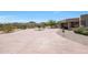 Large front yard with stamped concrete driveway and mountain views at 8876 S Santa Elizabeth Dr, Goodyear, AZ 85338