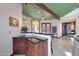 L-shaped bar with a dark wood finish and seating at 8876 S Santa Elizabeth Dr, Goodyear, AZ 85338