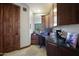 Home office with built-in desk and granite countertop at 8876 S Santa Elizabeth Dr, Goodyear, AZ 85338