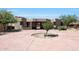 House exterior with a circular driveway and desert landscaping at 8876 S Santa Elizabeth Dr, Goodyear, AZ 85338
