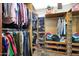 Large walk-in closet with ample shelving and hanging space at 8876 S Santa Elizabeth Dr, Goodyear, AZ 85338