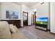 Relaxing sitting area with a sofa and adjacent bathroom view at 8876 S Santa Elizabeth Dr, Goodyear, AZ 85338