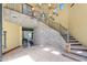 Stone staircase with wrought-iron railing, leading to upper level at 8876 S Santa Elizabeth Dr, Goodyear, AZ 85338