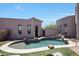 Freeform pool with waterfall feature and plenty of lounge space at 8876 S Santa Elizabeth Dr, Goodyear, AZ 85338