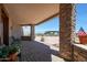 Covered patio with seating and mountain views at 8876 S Santa Elizabeth Dr, Goodyear, AZ 85338
