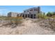 Large backyard with desert landscaping and a stone chimney at 8876 S Santa Elizabeth Dr, Goodyear, AZ 85338