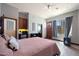 Comfortable bedroom with a queen-size bed and private door at 8876 S Santa Elizabeth Dr, Goodyear, AZ 85338