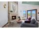 Stone fireplace with a large art piece above at 8876 S Santa Elizabeth Dr, Goodyear, AZ 85338