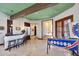 Game room with a bar, pinball machine and access to hallway at 8876 S Santa Elizabeth Dr, Goodyear, AZ 85338
