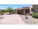 Desert landscape home with stone accents and a large driveway at 8876 S Santa Elizabeth Dr, Goodyear, AZ 85338