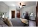 Spacious bedroom with a king-size bed and private access at 8876 S Santa Elizabeth Dr, Goodyear, AZ 85338