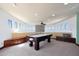 Game room featuring a pool table and multiple windows at 8876 S Santa Elizabeth Dr, Goodyear, AZ 85338