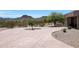 Expansive front yard with a stamped concrete driveway and desert landscaping at 8876 S Santa Elizabeth Dr, Goodyear, AZ 85338