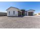 Two-story stucco home with a stone accent and two-car garage at 27502 N Freedom St, San Tan Valley, AZ 85144