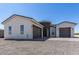 Two-story stucco home with a stone accent and two-car garage at 27502 N Freedom St, San Tan Valley, AZ 85144