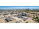 Aerial view of new houses under construction in a desert community at 27502 N Freedom St, San Tan Valley, AZ 85144