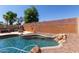 Resort-style pool with a large patio and fire pit at 3122 E Windmere Dr, Phoenix, AZ 85048