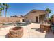 Inviting backyard oasis with a sparkling pool and fire pit at 3122 E Windmere Dr, Phoenix, AZ 85048