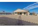 Backyard view of house, detached building, and path at 27536 N Freedom St, San Tan Valley, AZ 85144