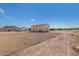 Large lot with gravel and a detached building at 27536 N Freedom St, San Tan Valley, AZ 85144