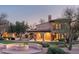 Stunning Spanish-style home with a fire pit and beautifully landscaped backyard at 24546 N 91St St, Scottsdale, AZ 85255