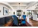 Formal dining room with dark wood table and blue velvet chairs at 24546 N 91St St, Scottsdale, AZ 85255