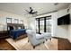 Elegant bedroom with a king-size bed, sitting area and hardwood floors at 24546 N 91St St, Scottsdale, AZ 85255