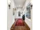 Long hallway with wine cellar and patterned floor at 24546 N 91St St, Scottsdale, AZ 85255