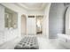 Luxurious bathroom with marble flooring, soaking tub, and walk-in shower at 24546 N 91St St, Scottsdale, AZ 85255