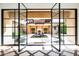View of a beautiful courtyard through open doors at 24546 N 91St St, Scottsdale, AZ 85255