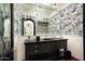 Elegant powder room with a black vanity and butterfly wallpaper at 24546 N 91St St, Scottsdale, AZ 85255