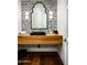 Stylish powder room with a floating vanity and hexagon tile at 24546 N 91St St, Scottsdale, AZ 85255