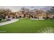 Luxury home with manicured lawn and paver driveway at 24546 N 91St St, Scottsdale, AZ 85255