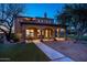 Stunning home exterior with arched entryways and a beautifully landscaped backyard at 24546 N 91St St, Scottsdale, AZ 85255