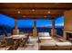 Covered patio with outdoor furniture, fireplace, and stunning mountain views at 24546 N 91St St, Scottsdale, AZ 85255